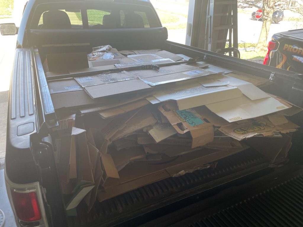 truck bed full of cardboard for recycling